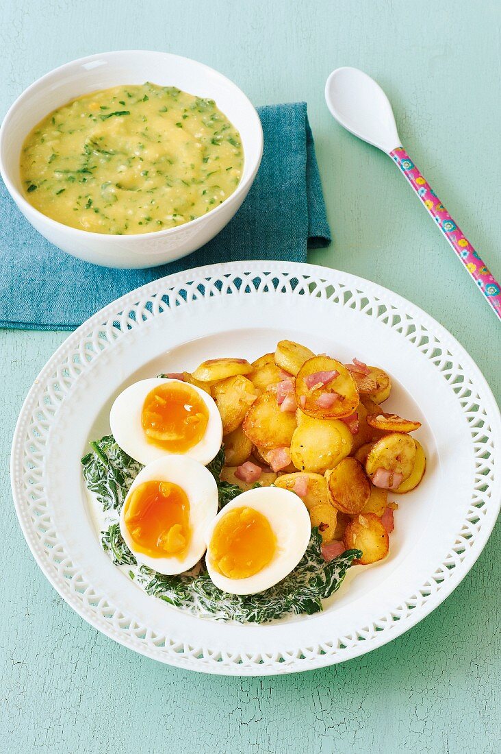 Potato and spinach baby food and a plate of fried potatoes and eggs