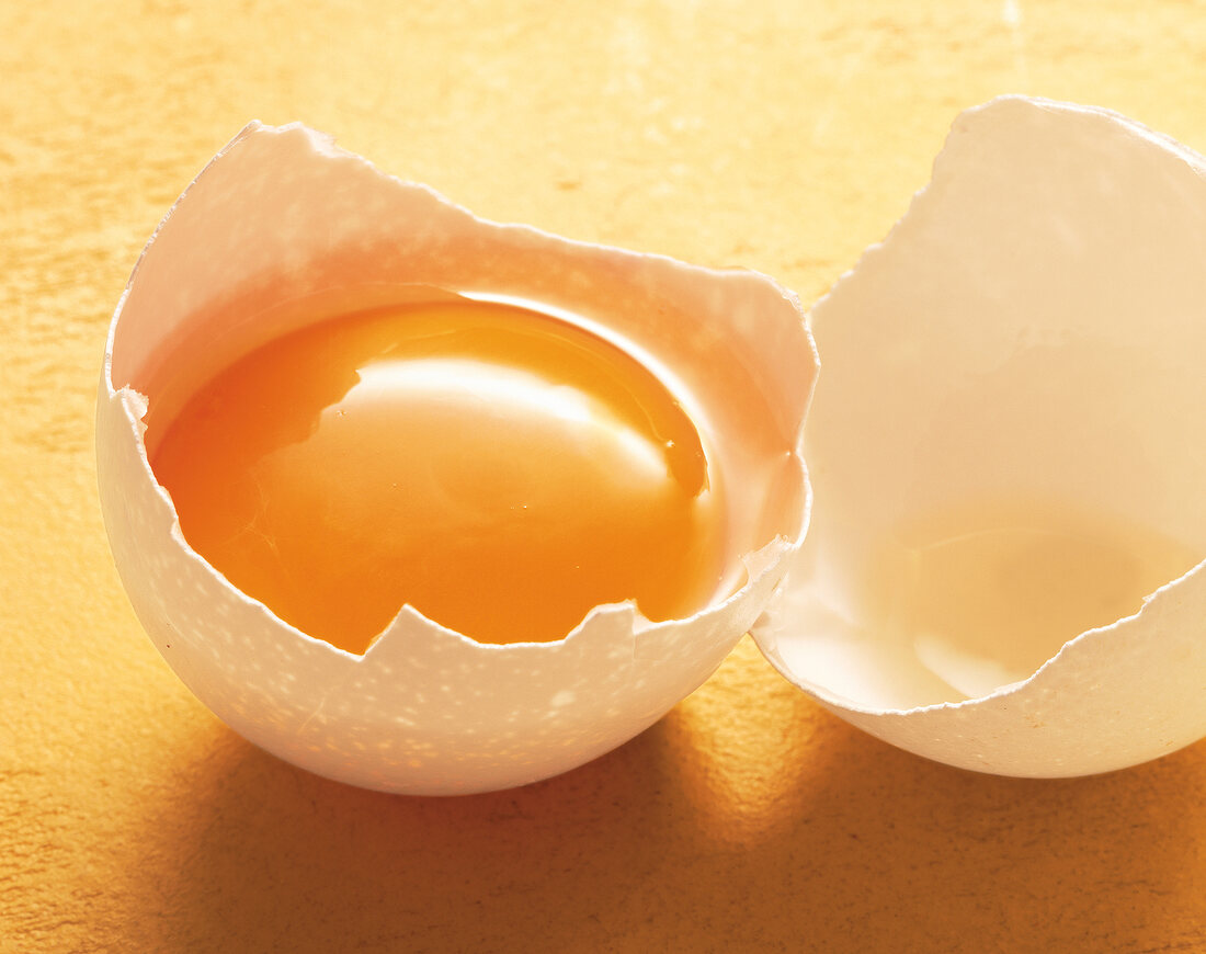 Raw egg in broken shell
