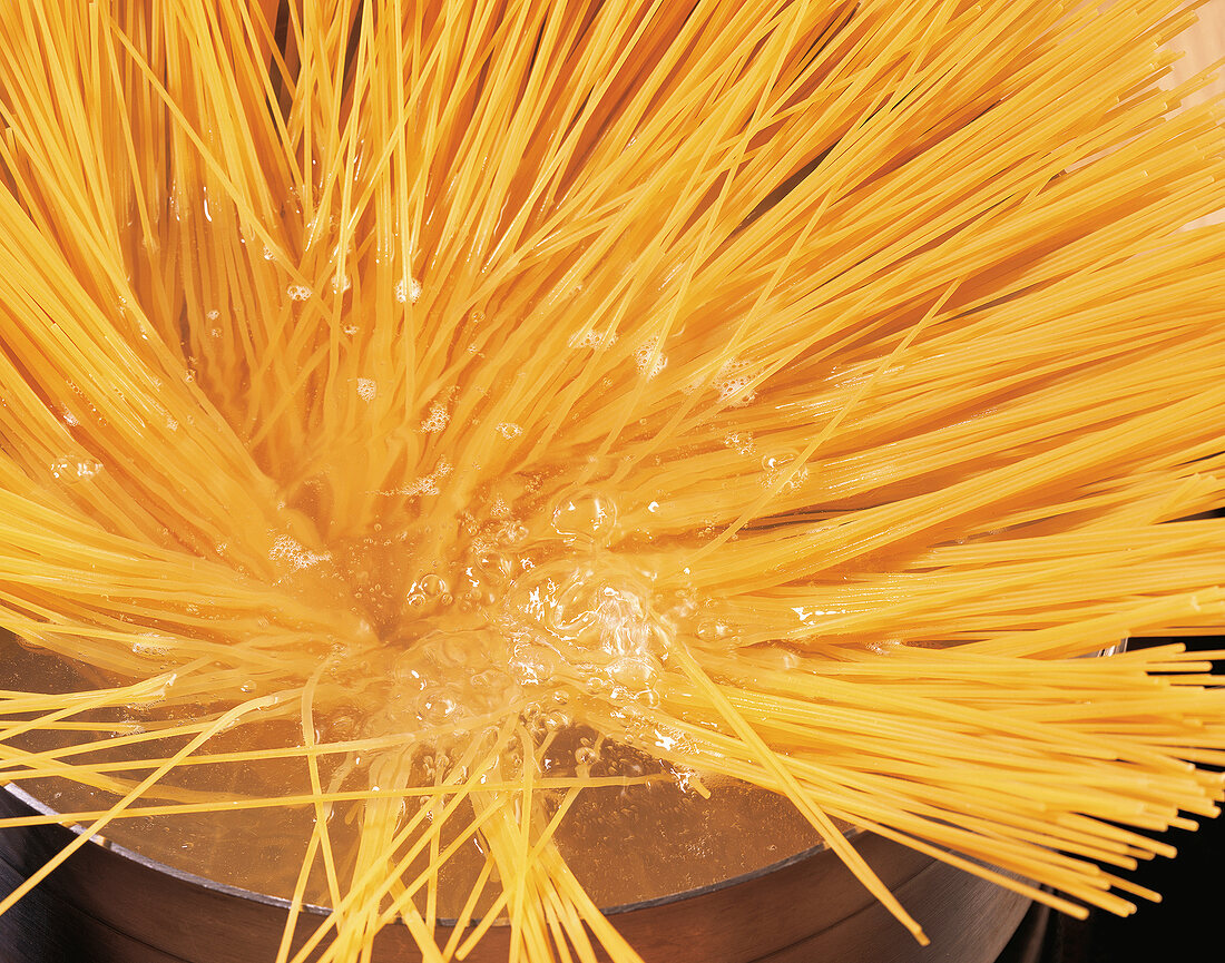 Close-up of spaghetti in boiling water