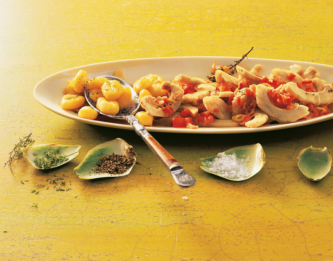 Gnocchi with artichoke ragout on plate