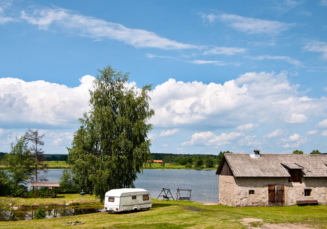 House and motor home besides Masurian Lake District, Mikolajki, Warmia Masuria, Poland