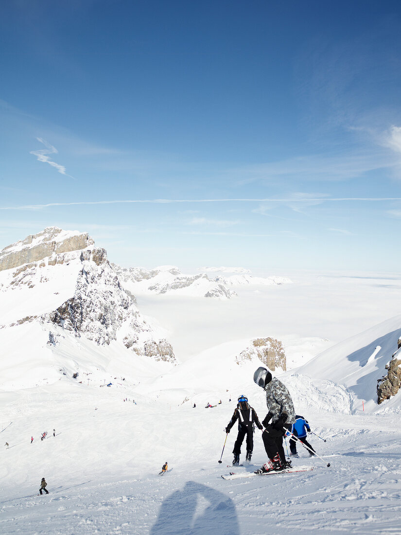 Skiers at the Joch Pass ski slope, Uri Alps, Titlis, Engelberg, Switzerland