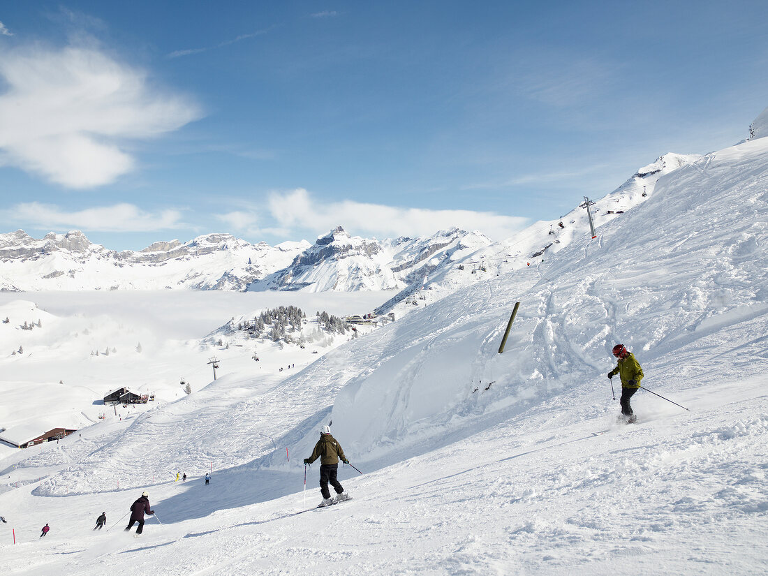 Skiers at the Joch Pass ski slope, Uri Alps, Titlis, Engelberg, Switzerland