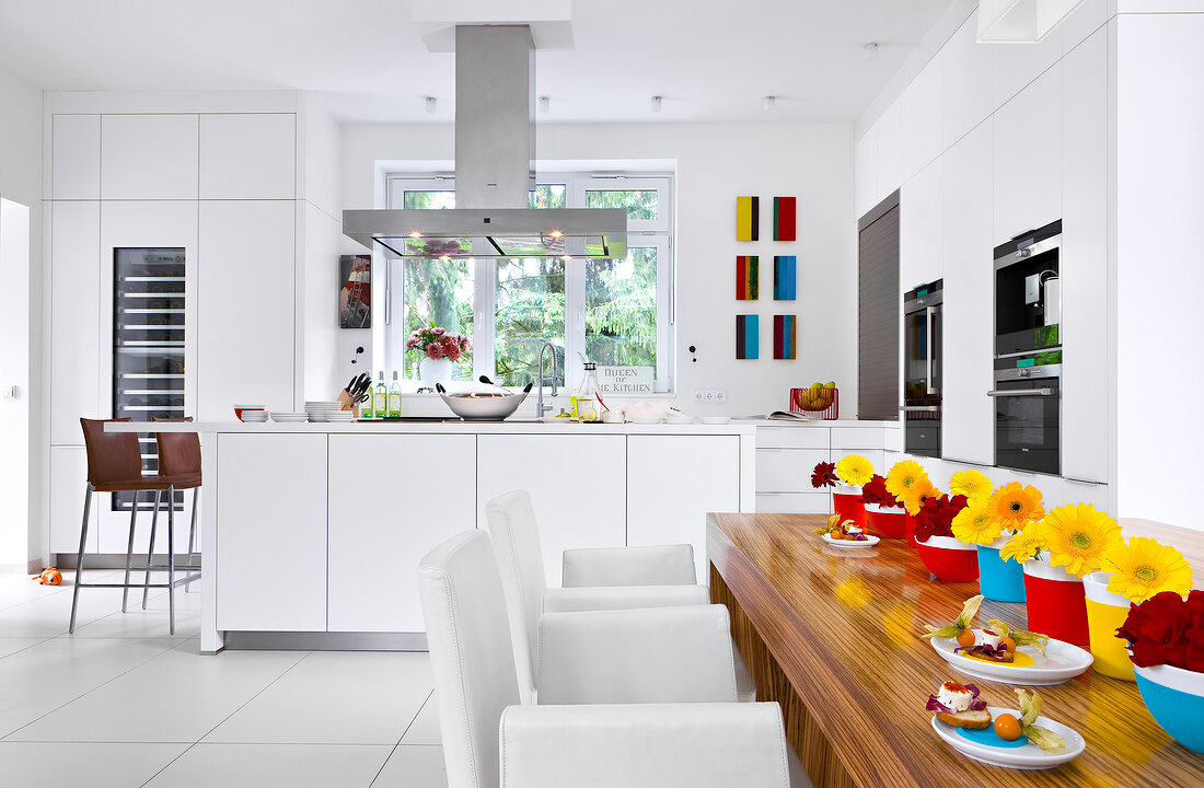 View of dining room with decorated dining table overlooking kitchen