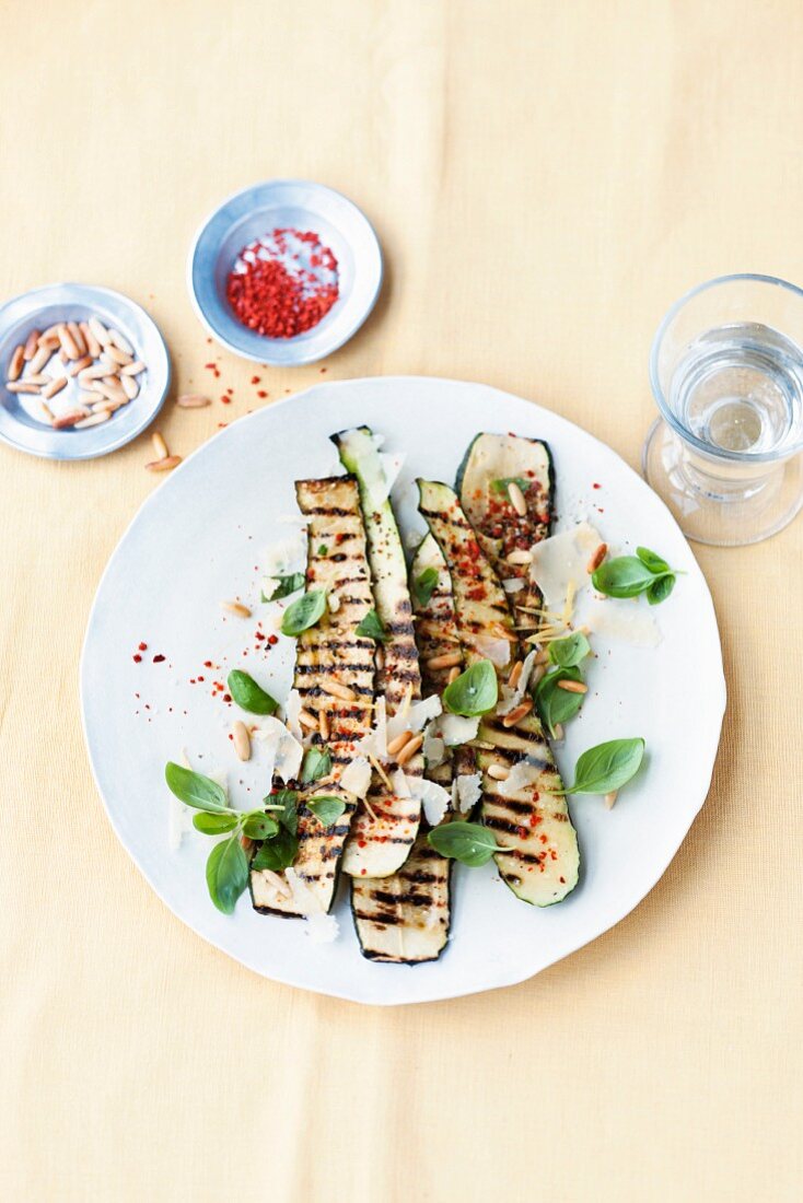 Grilled courgette with pine nuts and basil