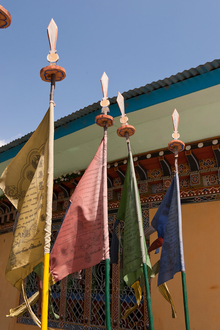 Close-up of prayer flags in front of house at Bhutan