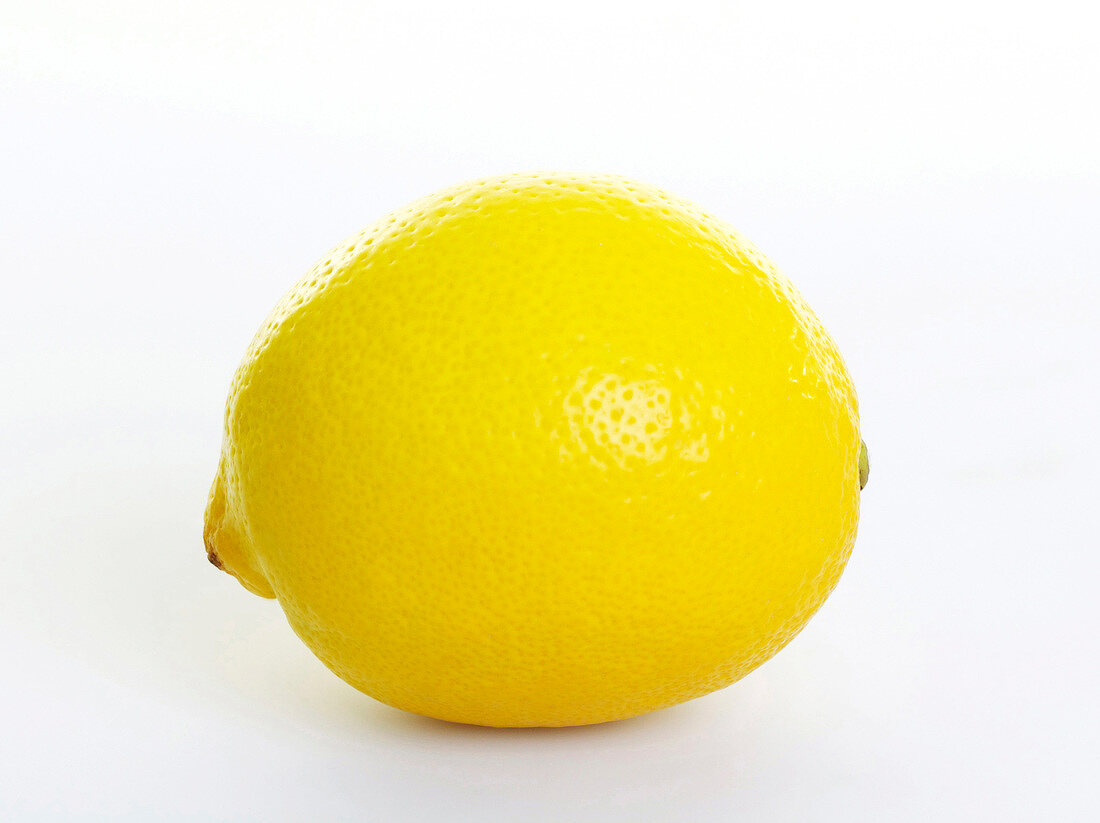 Close-up of lemon on white background