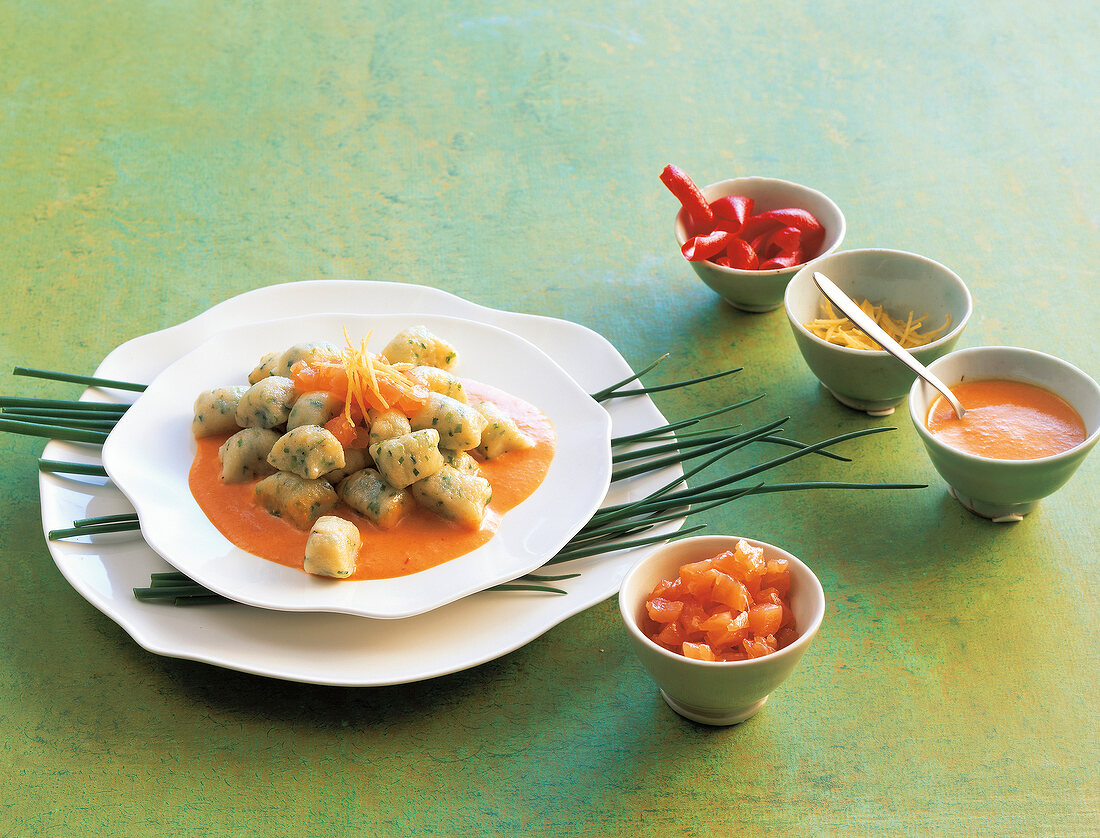 Chives dumplings with smoked salmon on plate