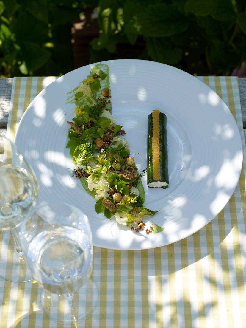 Cauliflower mousse with wild herbs and whitefish caviar on plate