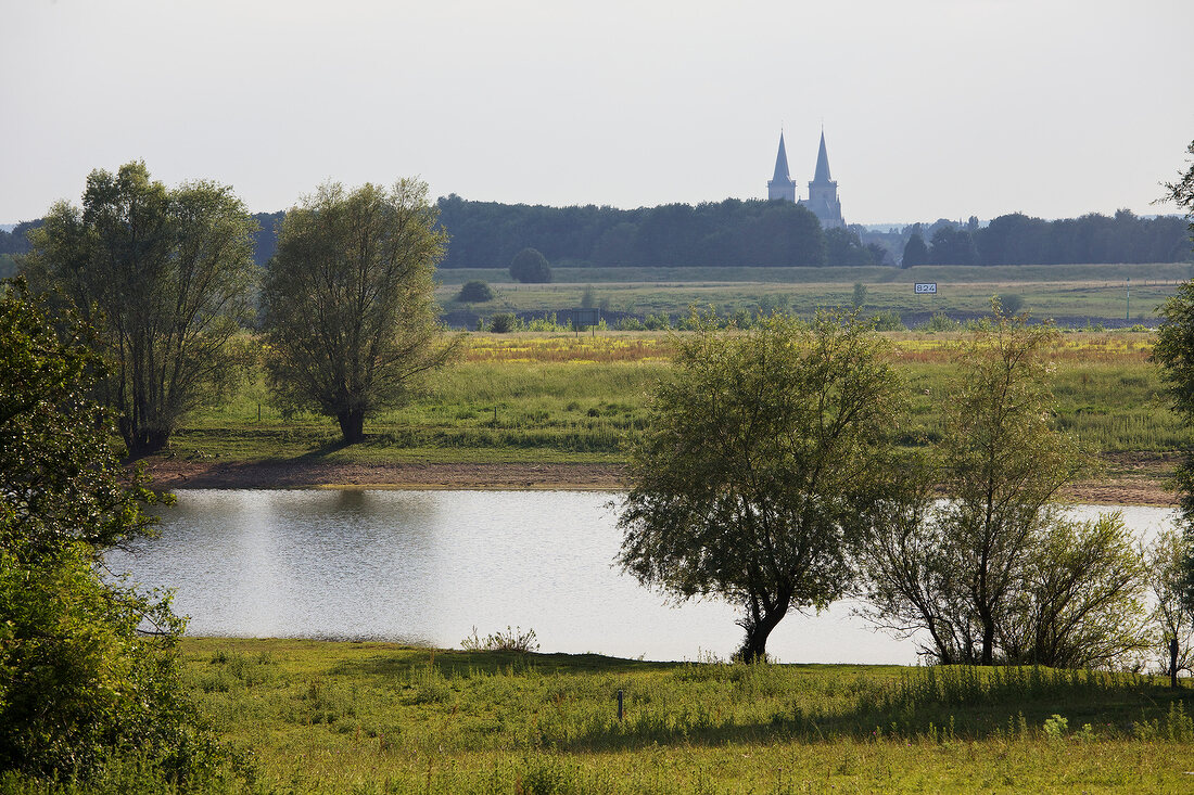 View of Rhine river at Wesel-Bislich and Cathedral of Xanten, Niederrhein, Germany