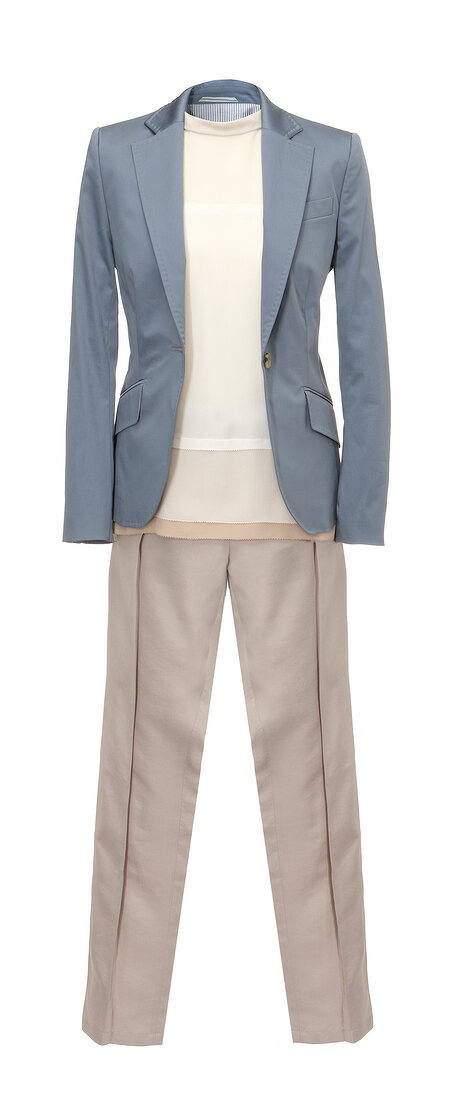 Grey cotton blazer, pants and cotton shirt in layered look on white background