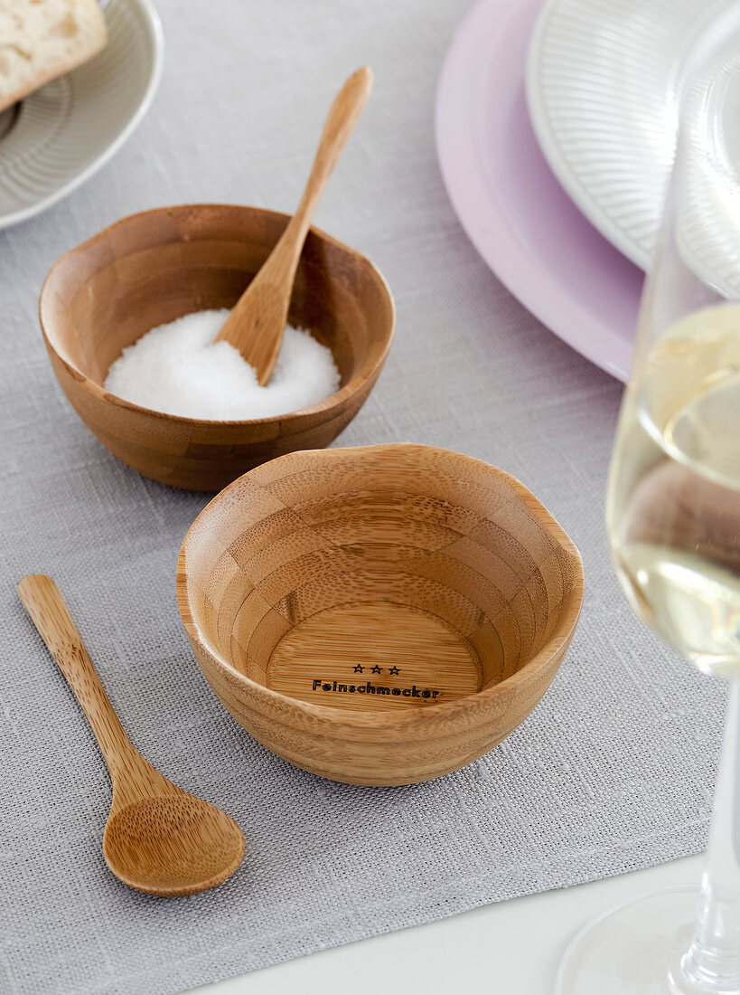 Bowls and spoon made from bamboo with salt in it