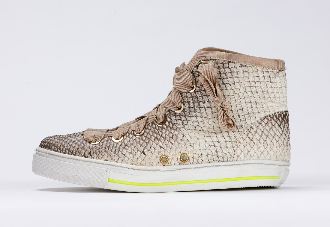 Creme croc patterned sneaker on white background