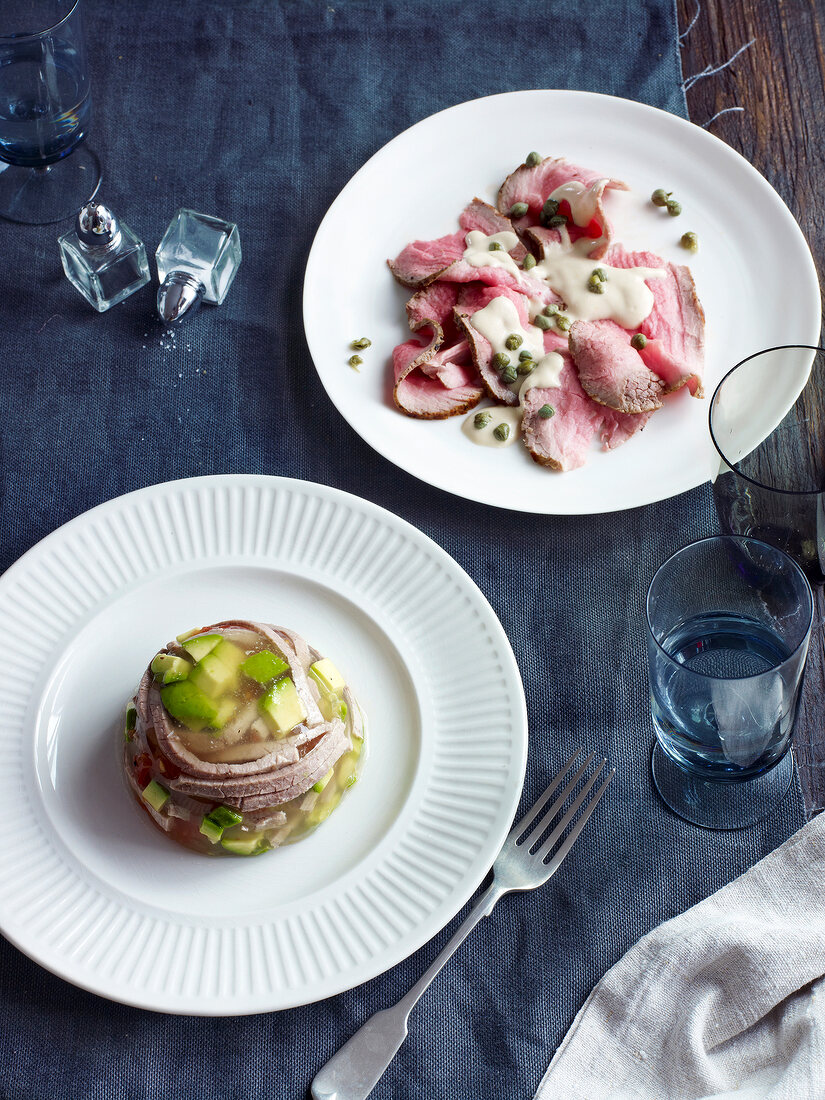 Boiled beef in aspic and vitello tonnato on plate