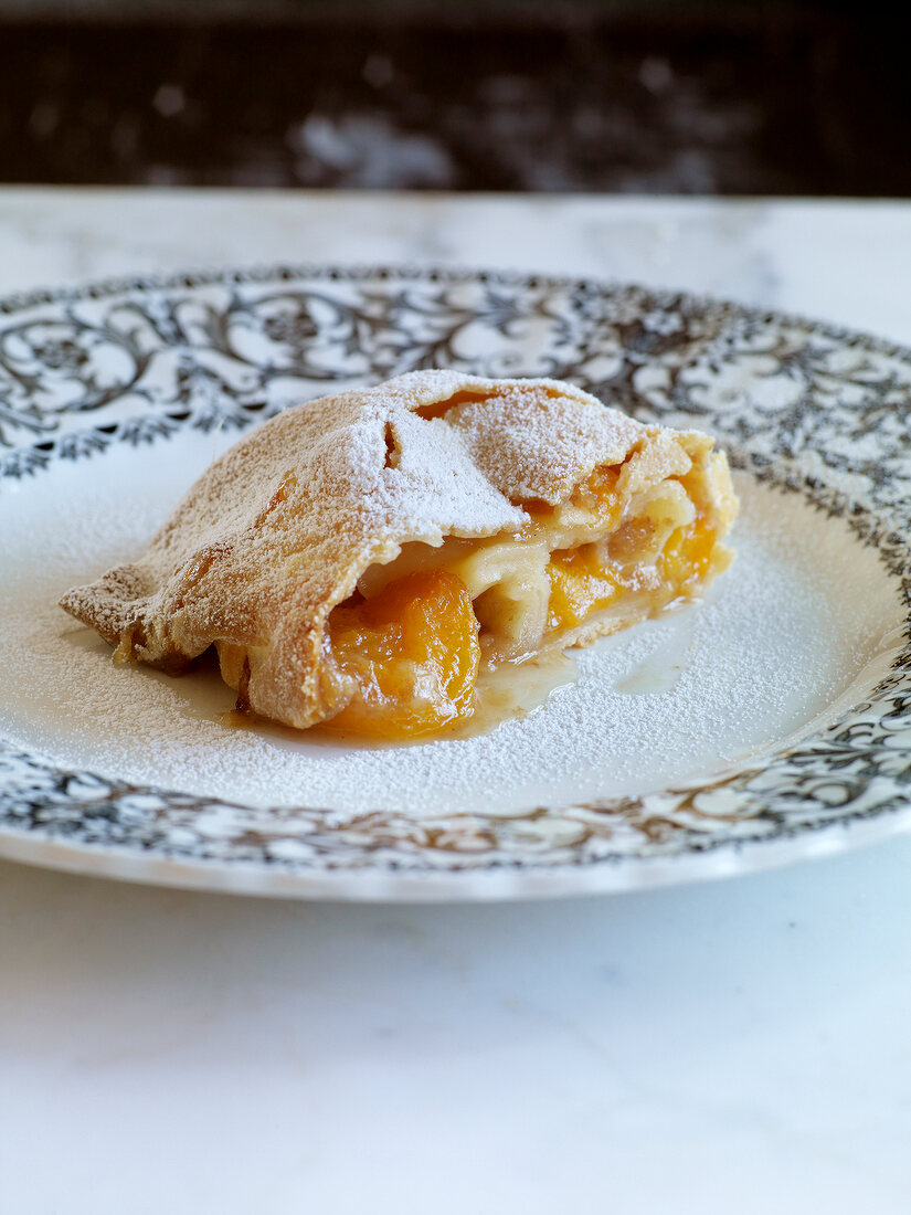Close-up of apricot strudel on plate