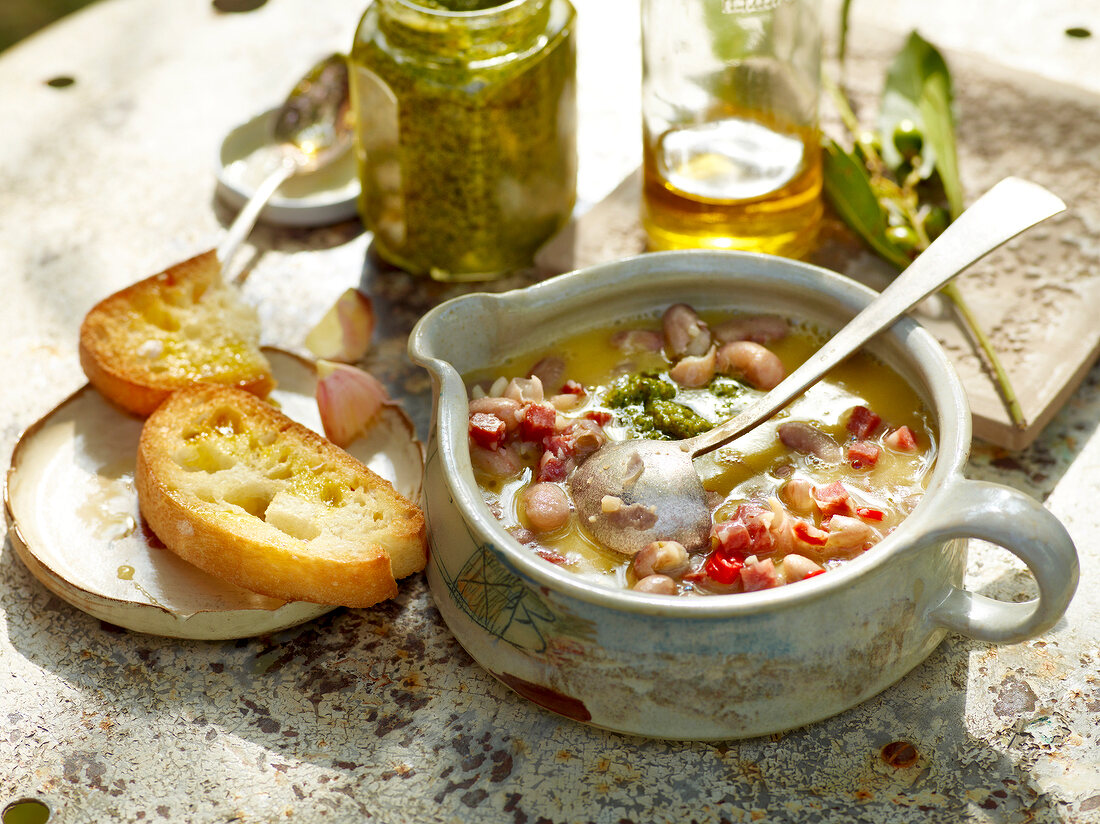 Easy bean soup with parsley salsa in pot