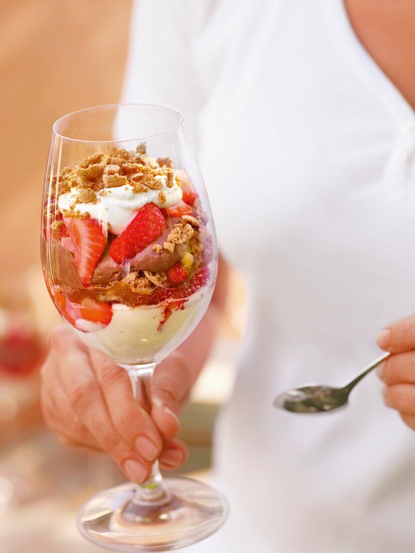 A desert with lemon mousse, chocolate cream, strawberries and amaretti