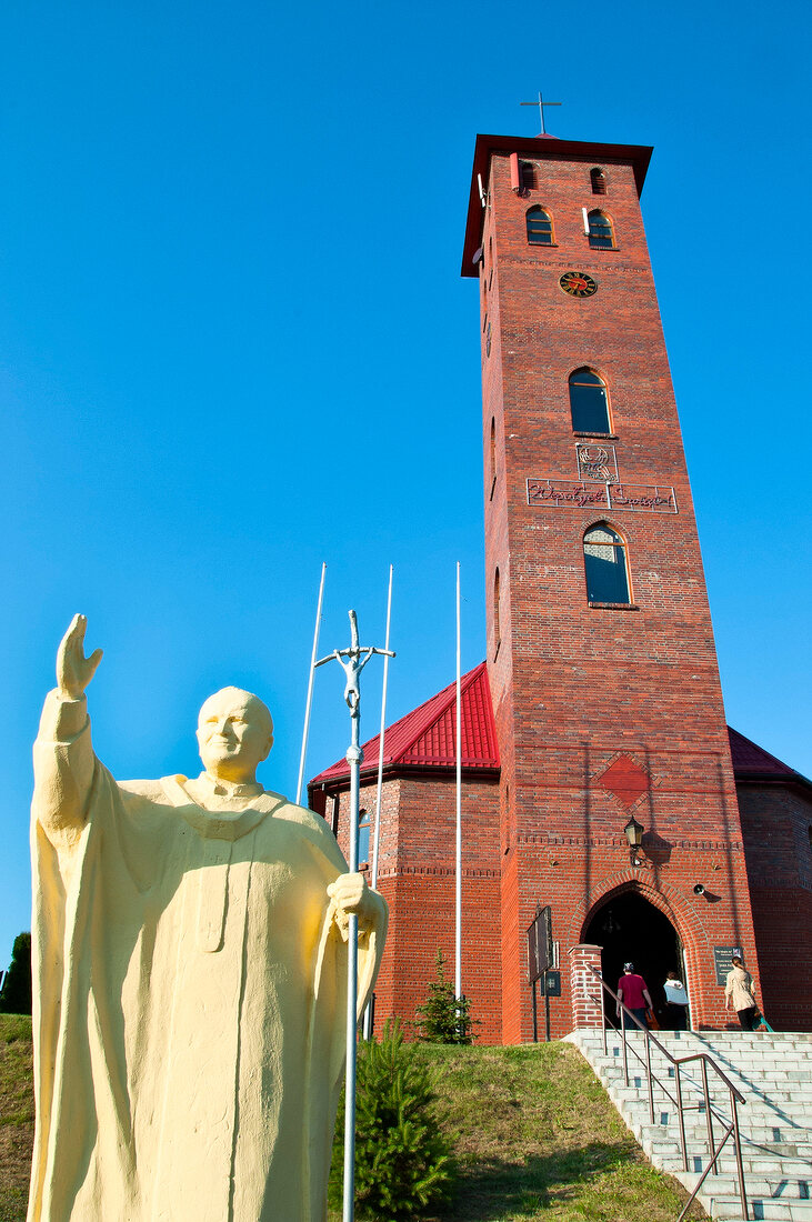 Statue of Parafia and Sw. Mikolaja steeple at Mikolajki, Warmian-Masurian, Poland
