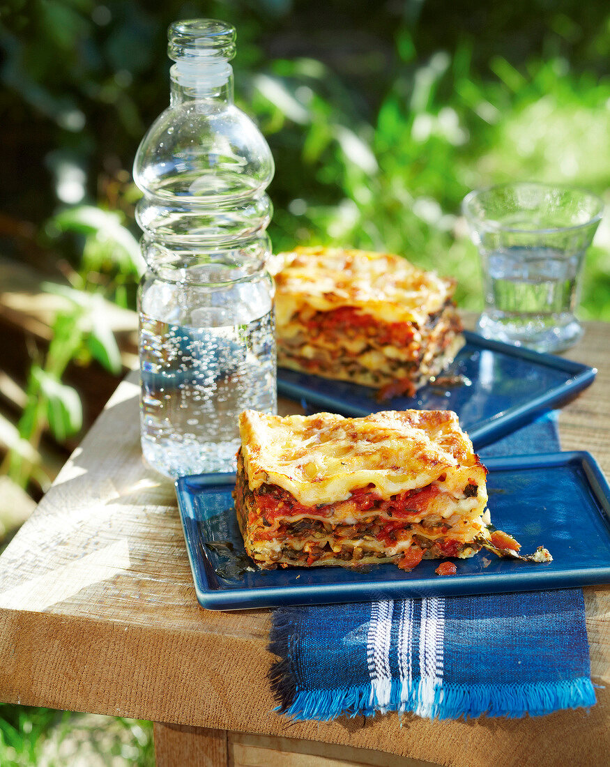 Swiss chard lasagna in blue serving dish