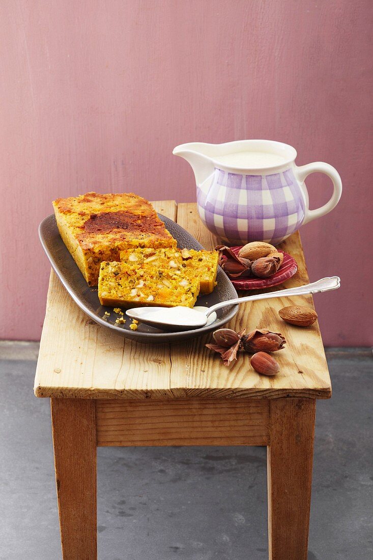 Baked carrot pudding with nuts and a marzipan source