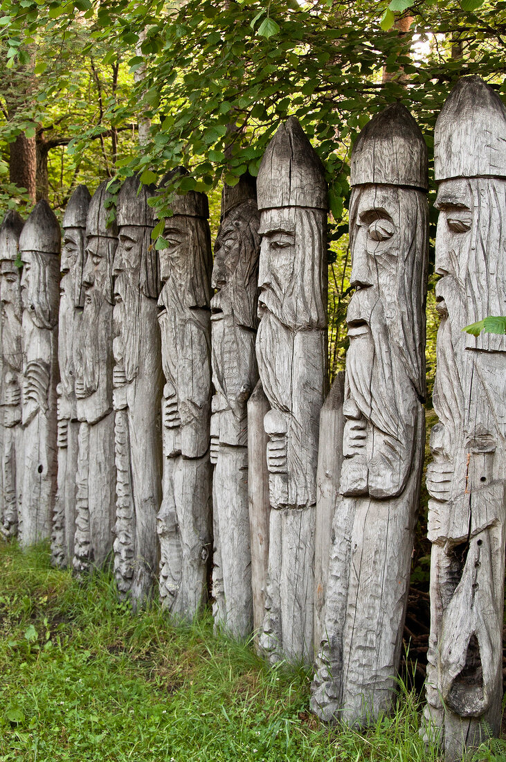 Wooden sculptures in a row, Galindia Mazurski Eden, Warmia Masuria, Poland