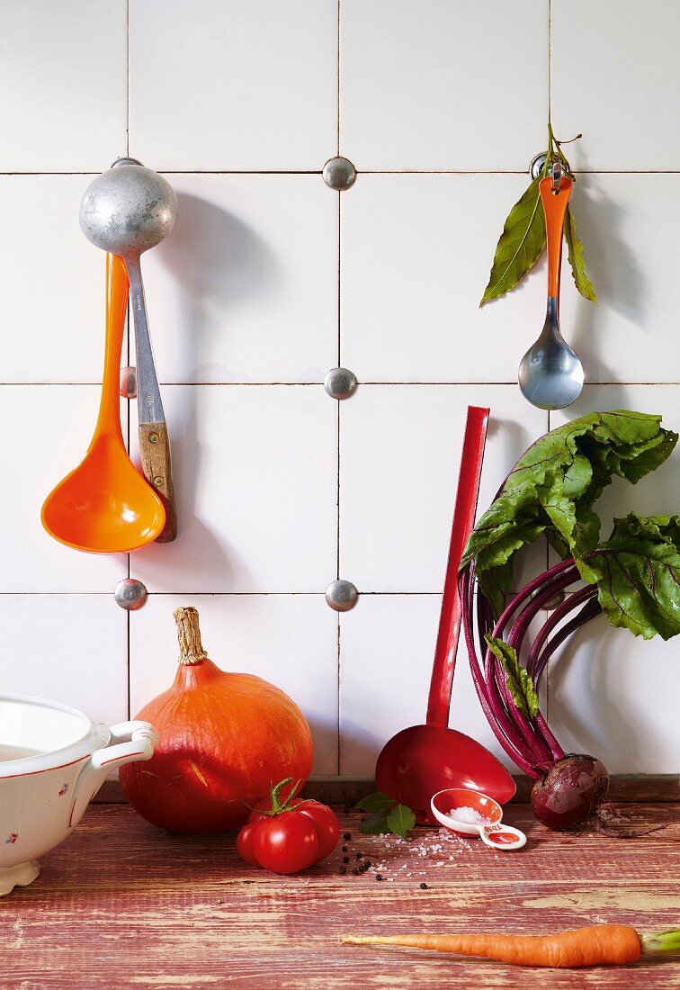 An arrangement of soup utensils and vegetables