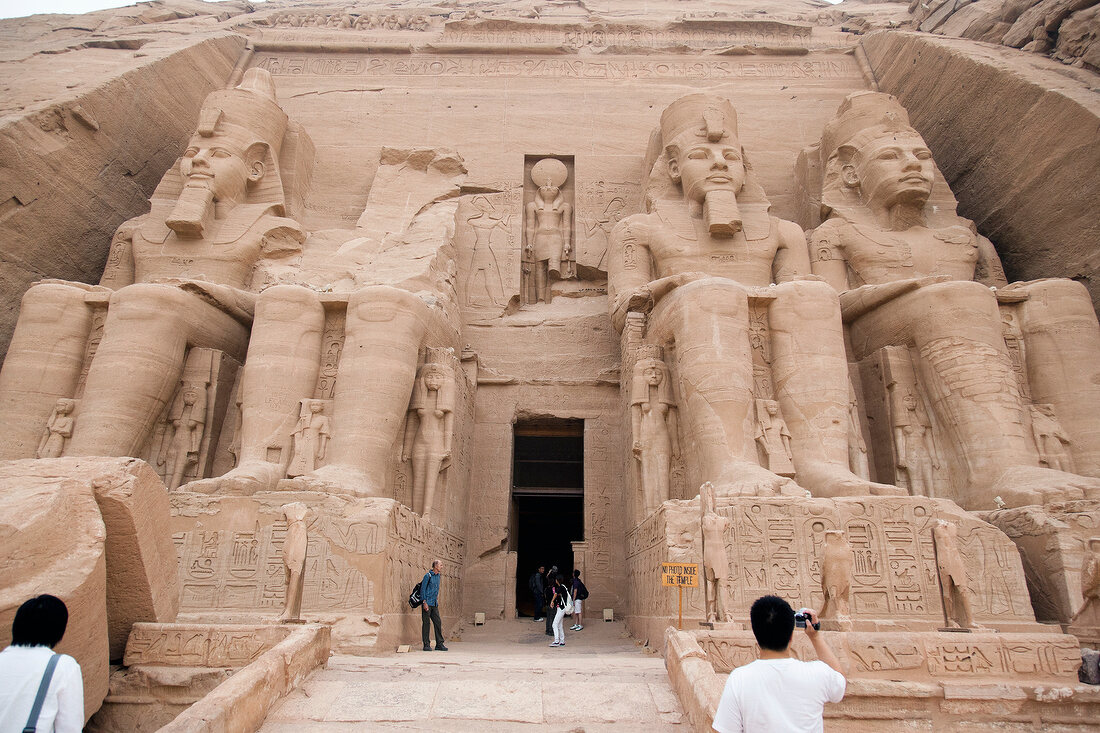 Tourist at entrance of Abu Simbel temple in Egypt