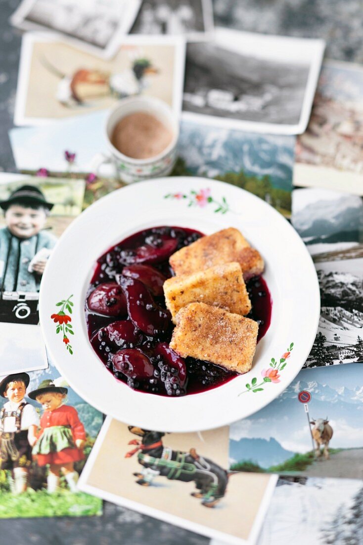 Hollerkoch (stewed elderberries and damsons) with semolina slices (Austria)