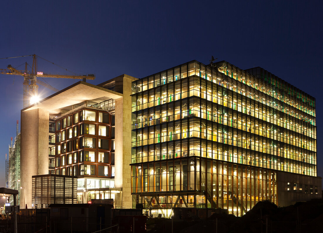 View of illuminated public library and music conservatory in Amsterdam, Netherlands