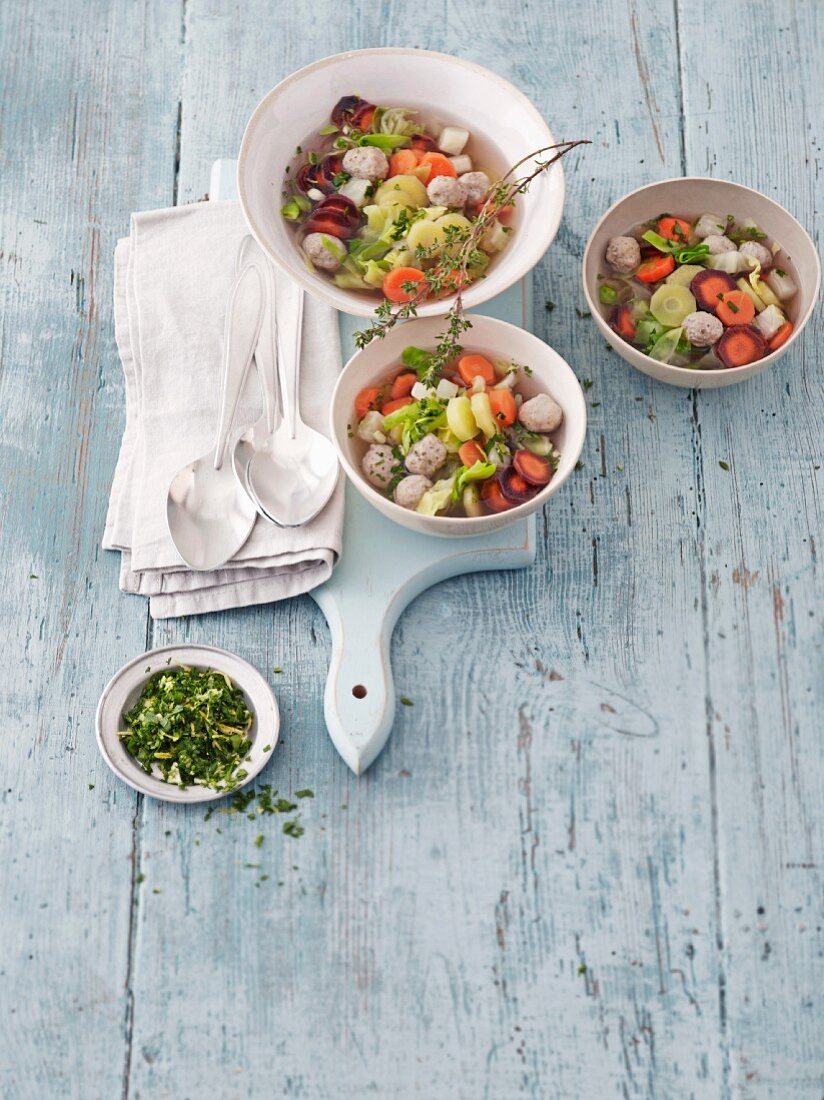 Minestrone with pointed cabbage, a trio of carrots, dumpling and gremolata