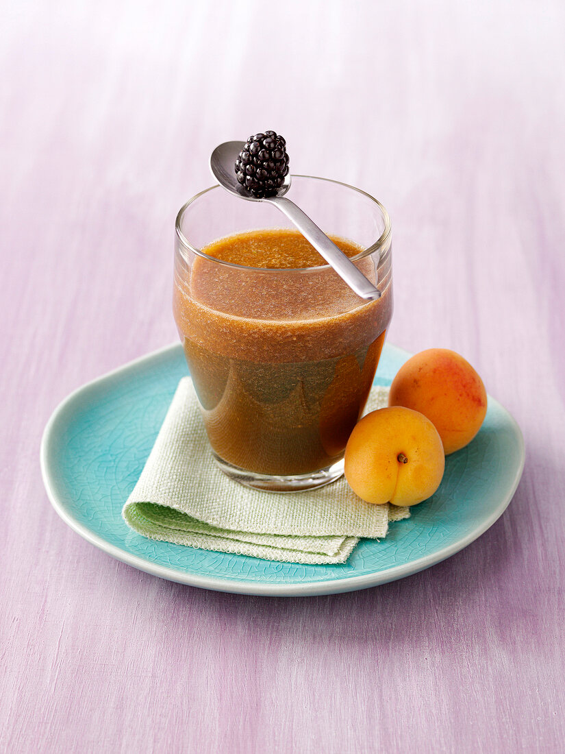 Blackberry and peach smoothie for detoxing in glass