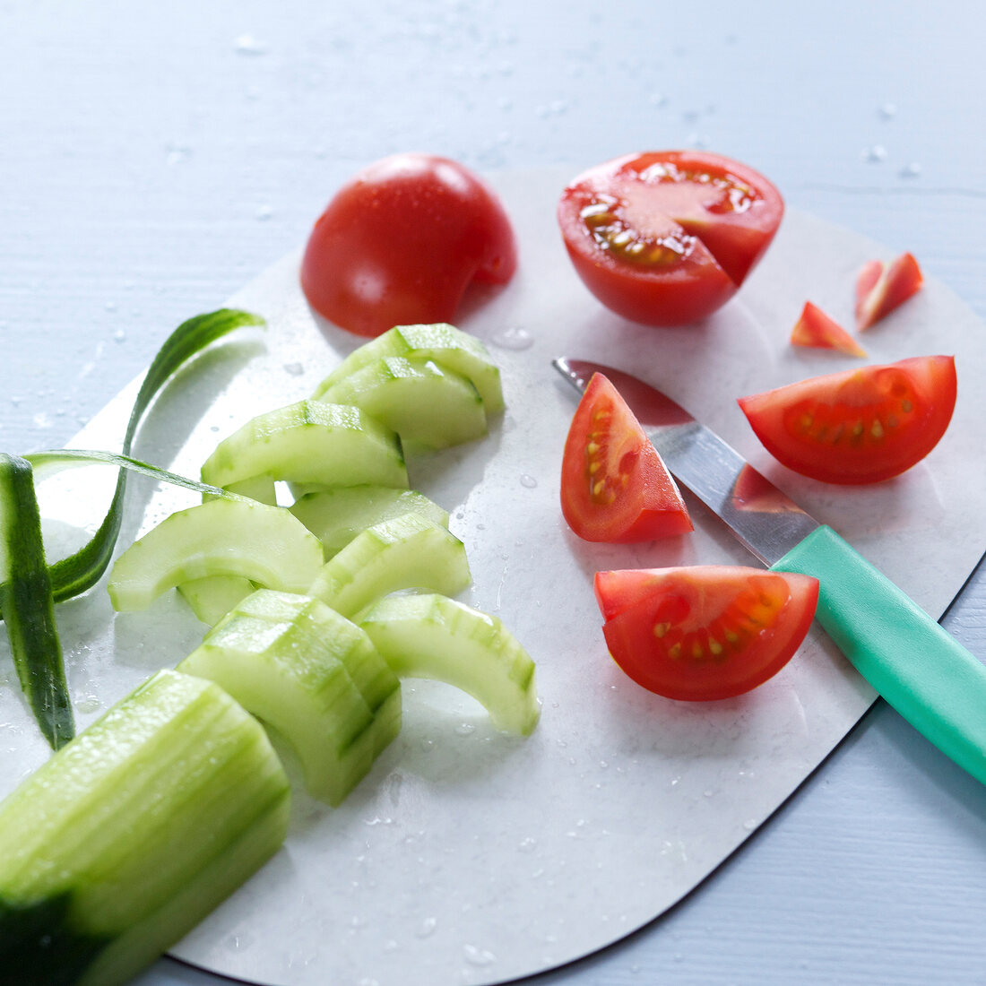Close-up of tomato and cucumber pieces, step 2