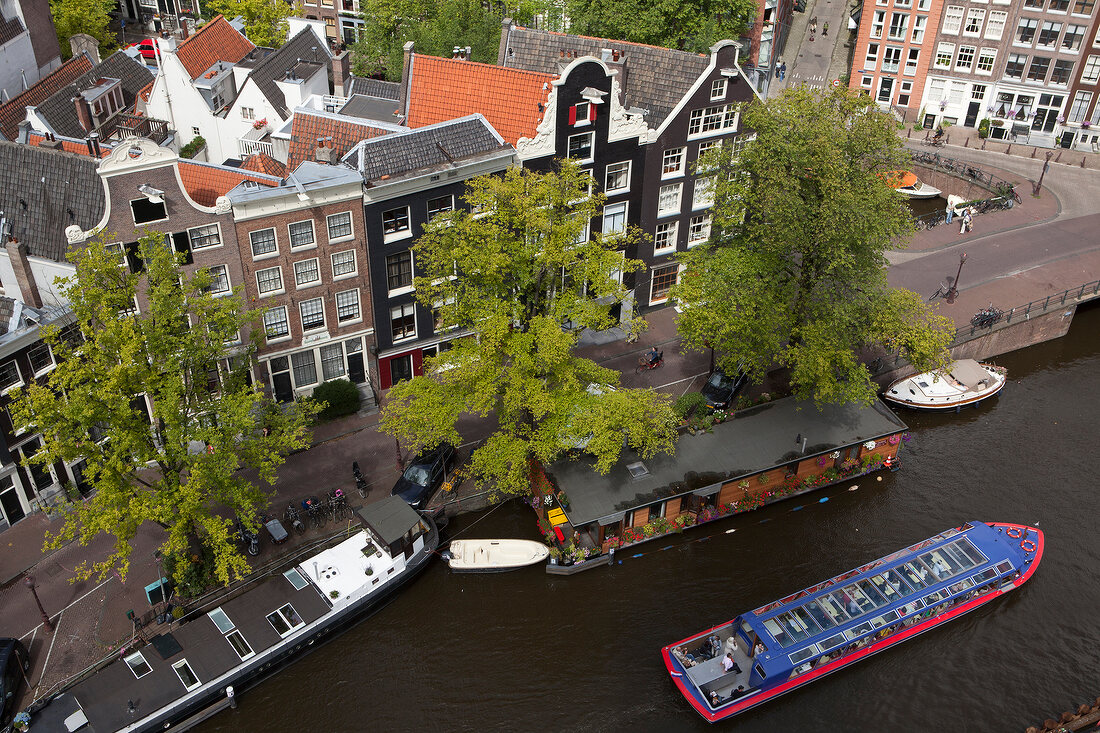 View of Prinsengracht, Old Town, and ferryboat from Westerkerk, Amsterdam, Netherlands