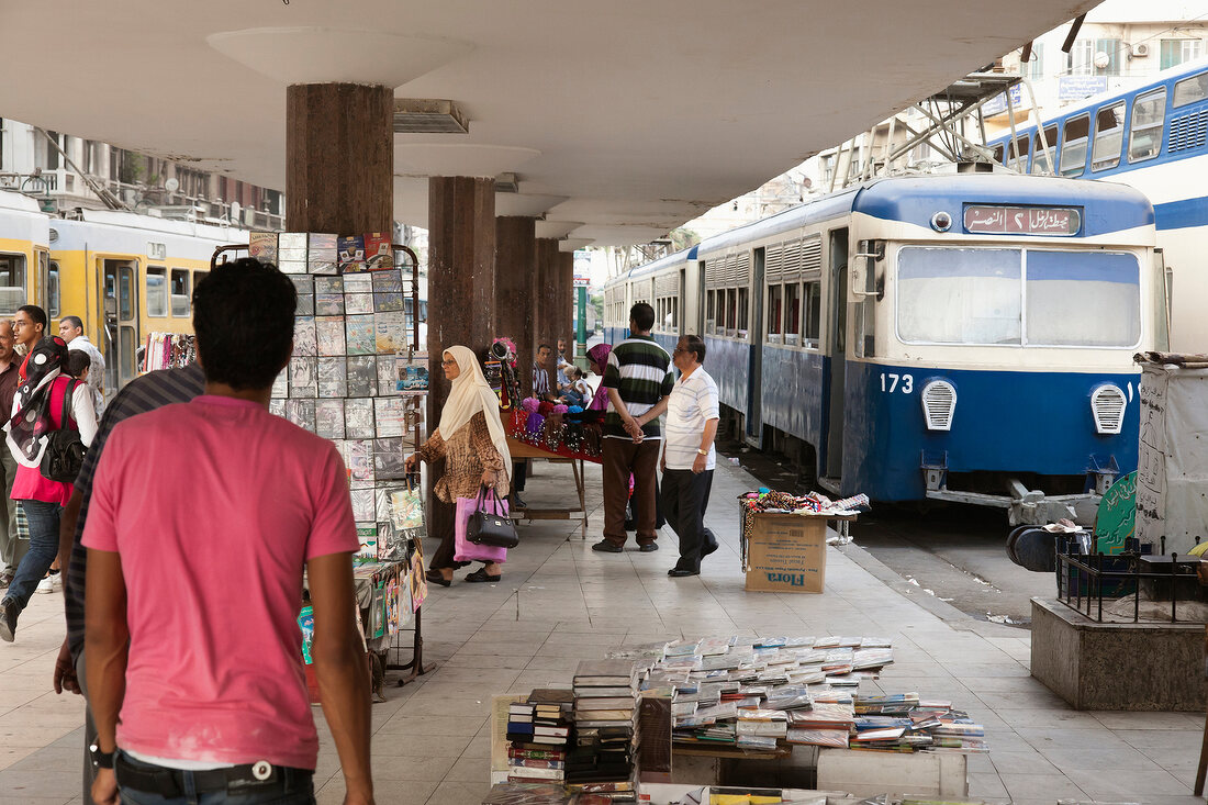 Trams and people on platform at De Pijp, Amsterdam, Netherlands