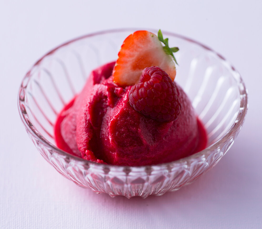 Strawberry and raspberry sorbet in glass bowl