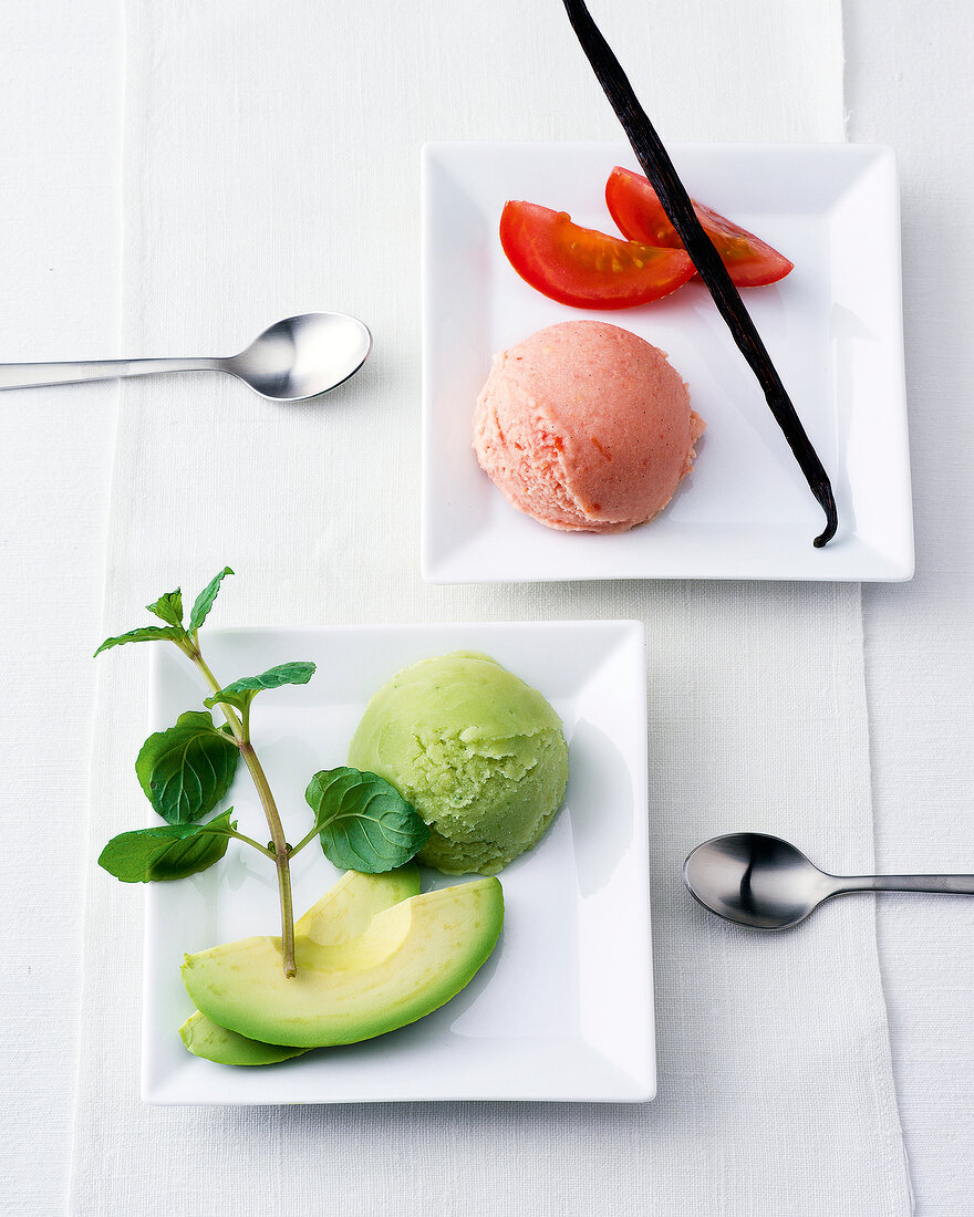 Avocado sorbet and tomato-coconut sorbet on square plates