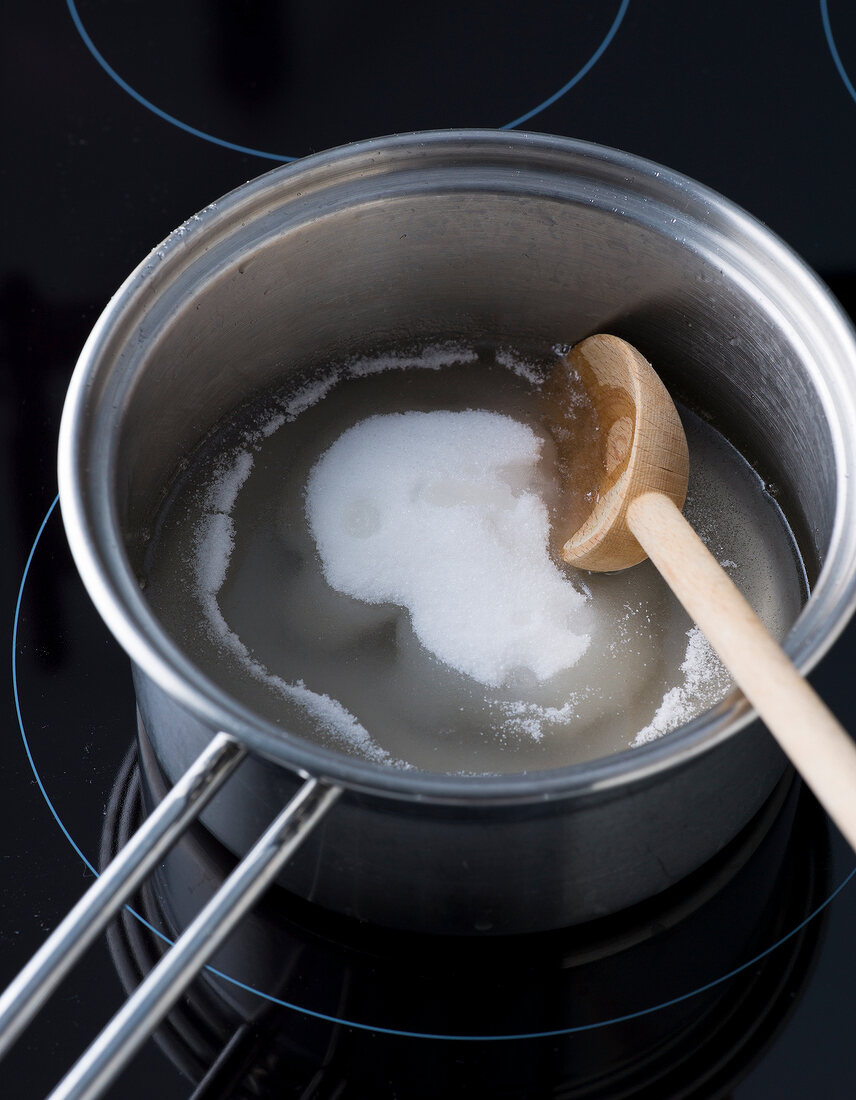 Close-up of sugar syrup being made in sauce pan