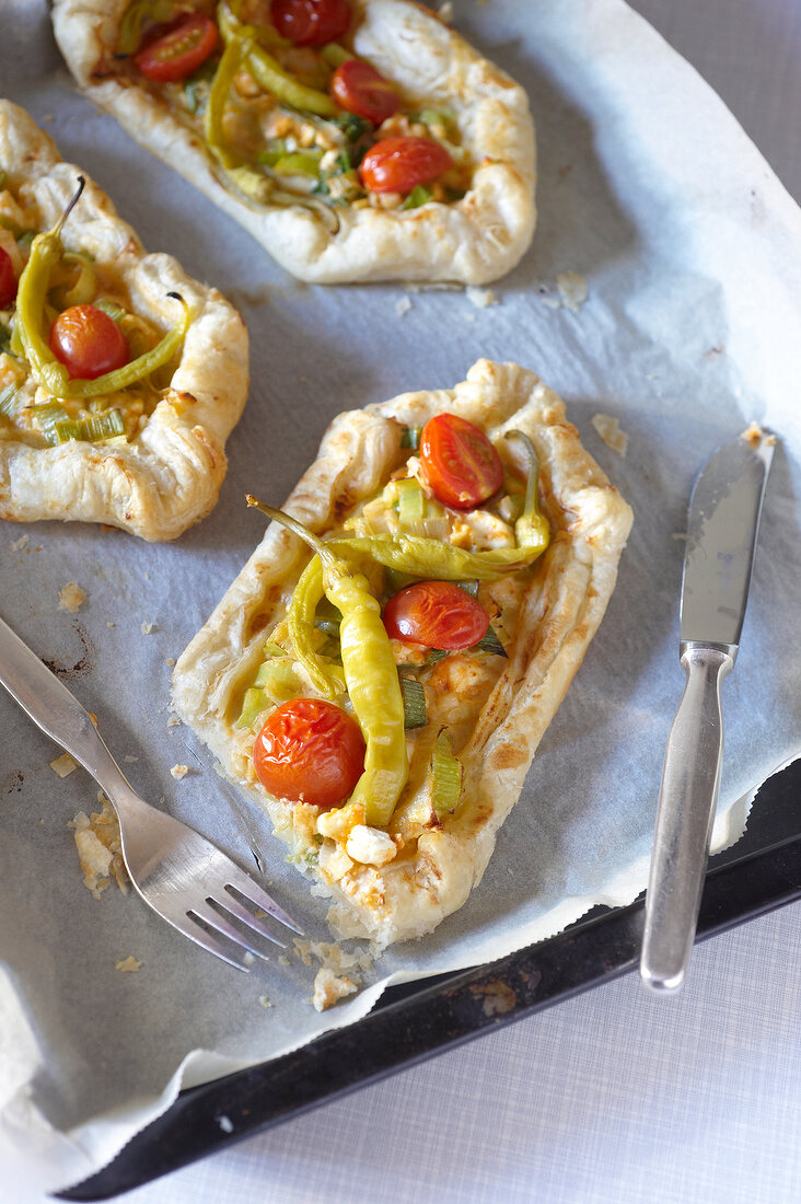 Puff pide with leeks on baking dish