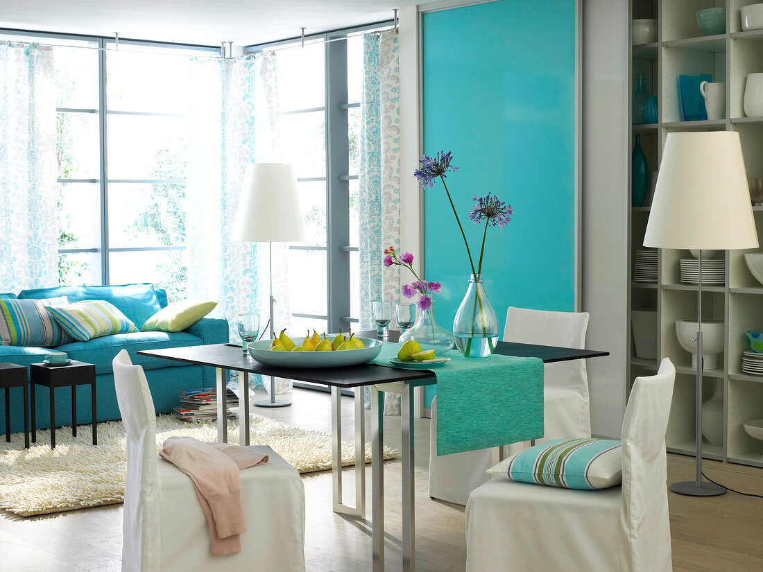 Living room and dining area in blue and turquoise shades