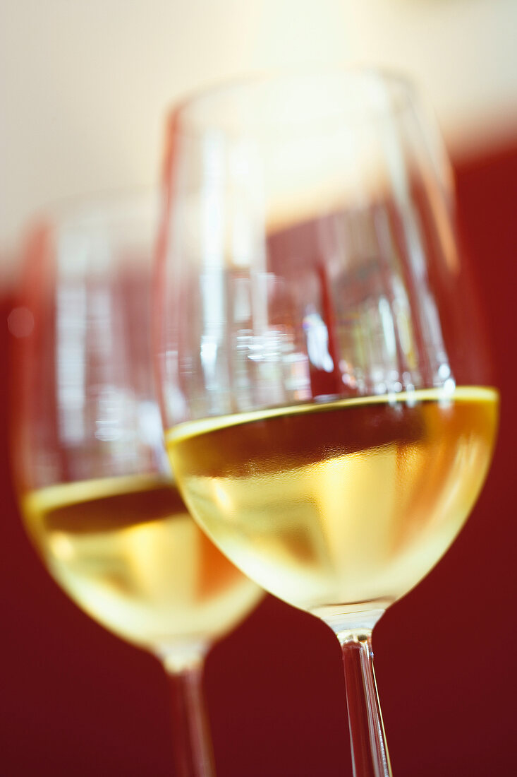 Close-up of two glasses of white wine