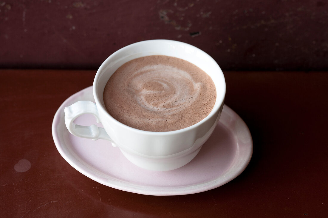 Cup of hot chocolate on saucer 