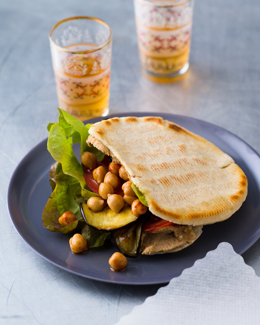 Salad with eggplant and chickpeas on plate