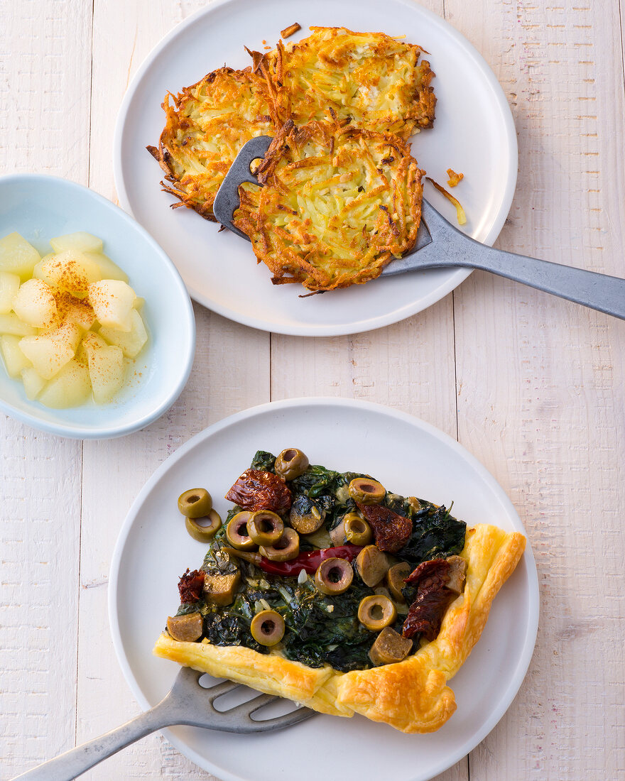 Tofu hash browns with compote and spinach puff pastry tart on plates
