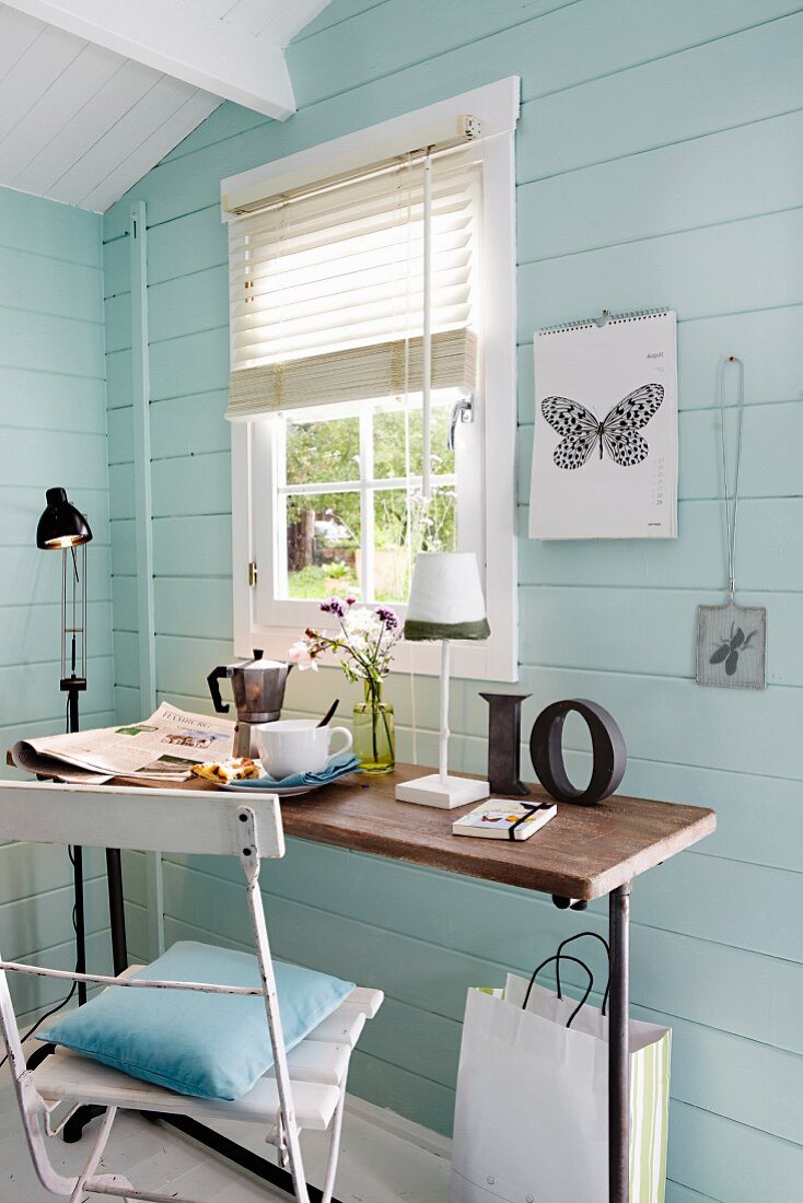 Table & chair in blue, wooden, Scandinavian-style guest house