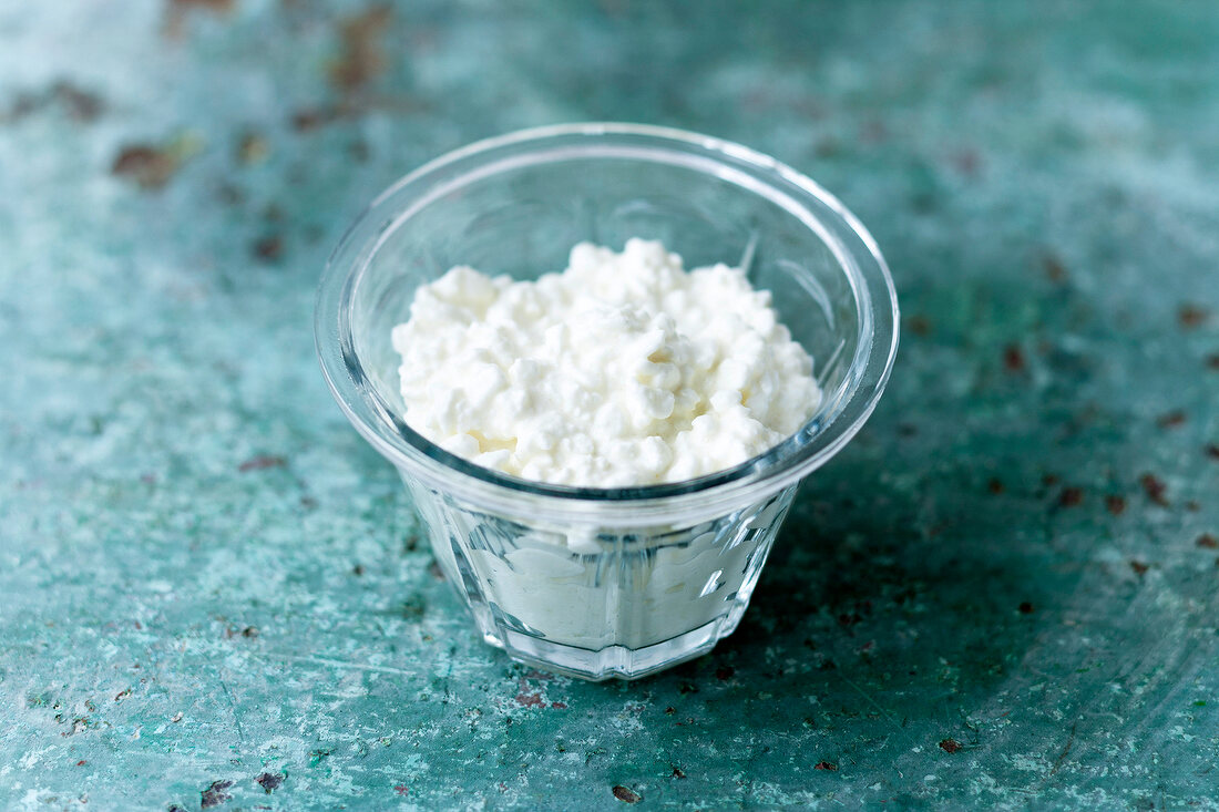 Close-up of cottage cheese in glass bowl