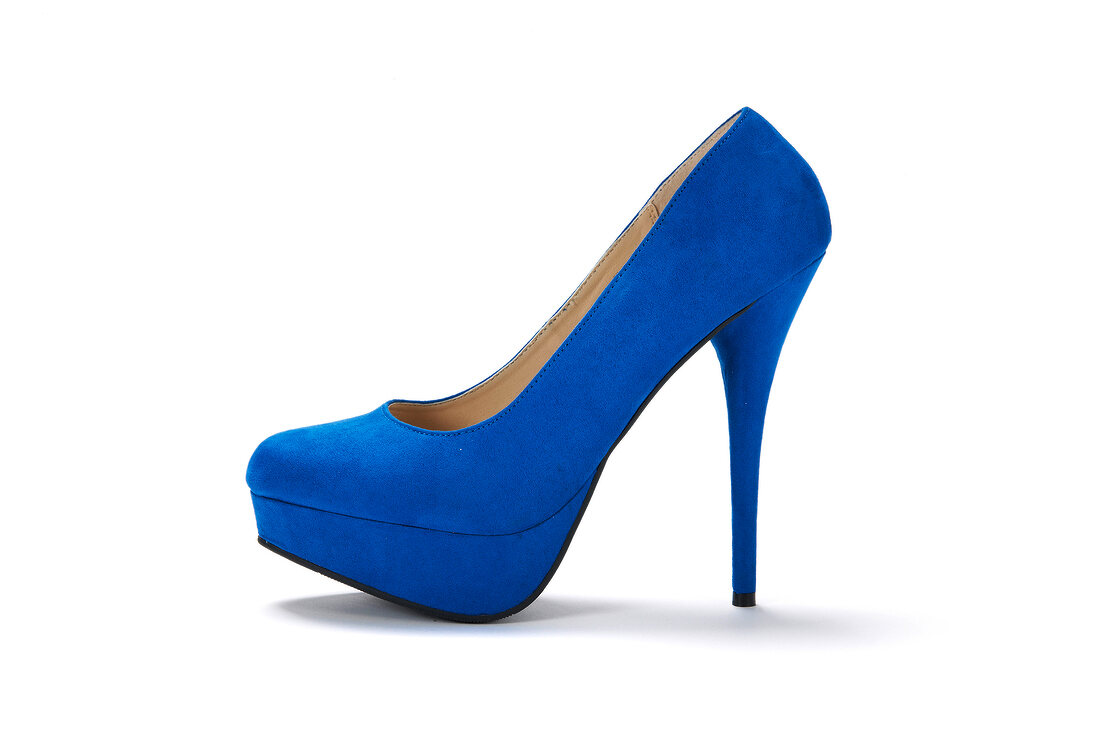 Close-up of royal blue plateaus pumps on white background