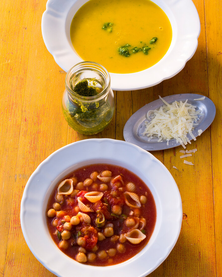 Pumpkin soup and chickpea soup in serving dishes