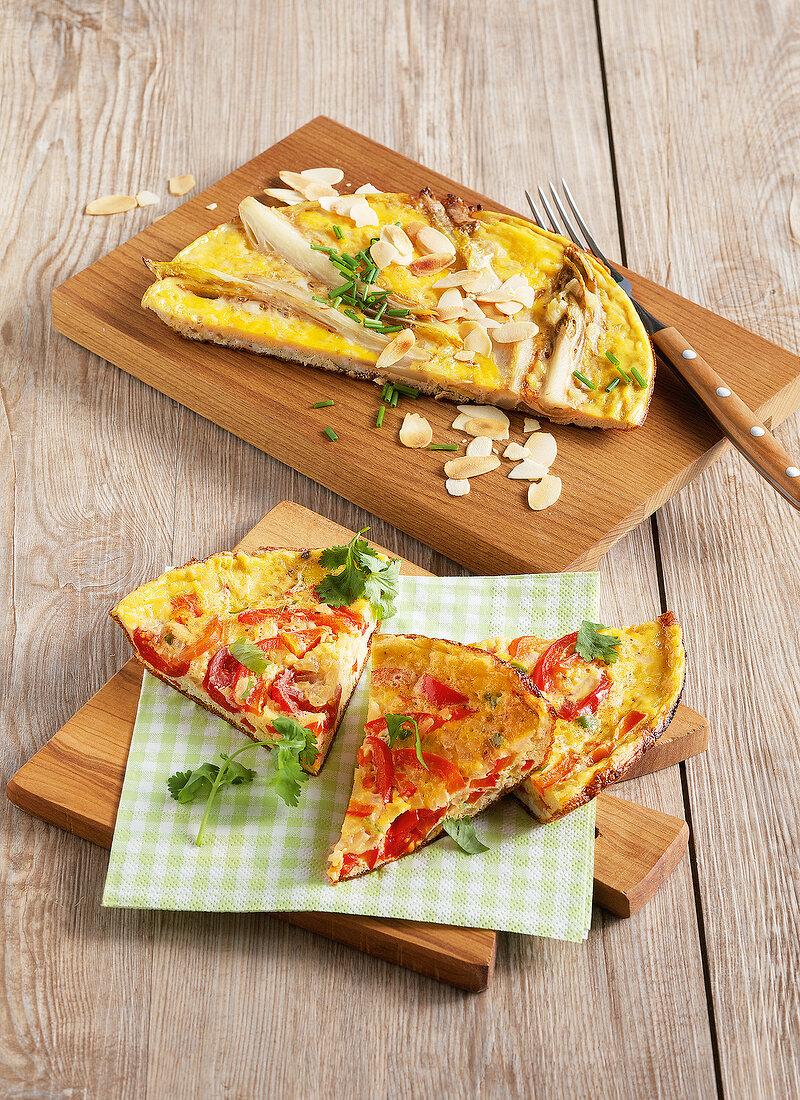 Creole pancakes and chicory omelette on wooden board