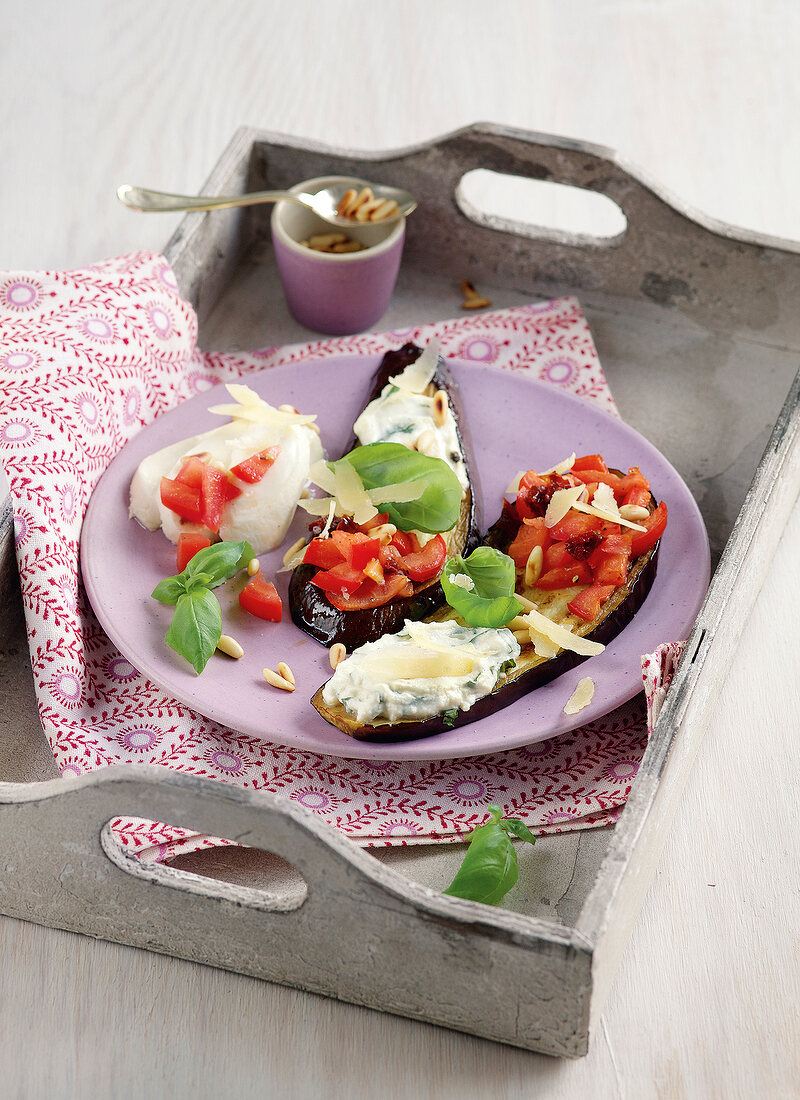 Eggplant chips with tri colour toppings on plate