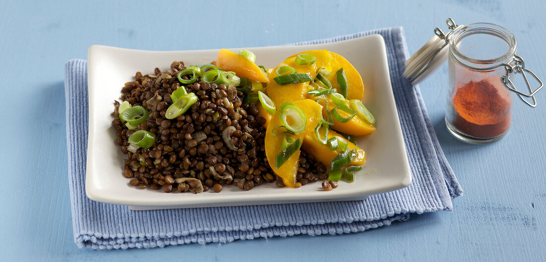 Lentils with caramel and apricot on plate